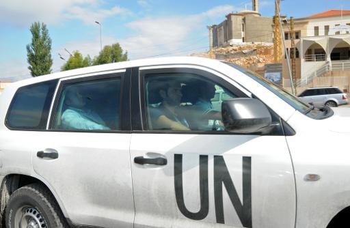 Un véhicule de l'ONU est perçue à la frontière libano-syrienne comme inspecteurs de l'ONU retournent en Syrie le 25 Septembre 2013.