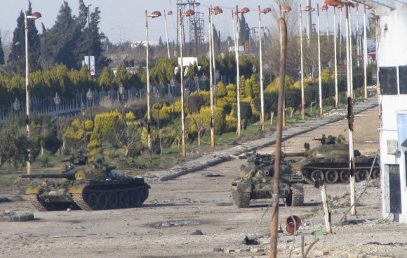 879963_syrian-tanks-are-seen-in-bab-amro-near-the-city-of-hom
